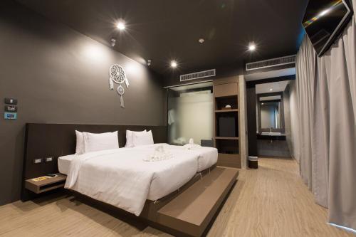 Postel nebo postele na pokoji v ubytování Maya Phuket Airport Hotel-Naiyang Beach