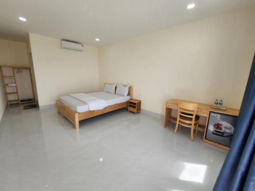 Ένα ή περισσότερα κρεβάτια σε δωμάτιο στο Hoàng Hôn Nhớ