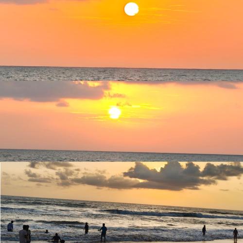 a group of people on the beach at sunset at Gokarna Govekar Sea Facing Rooms in Gokarn