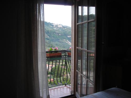 an open window with a view of a balcony at B&B L'Arcobaleno in Sorrento