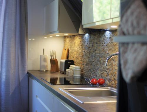 A cozinha ou cozinha compacta de Apartamenty Bryza