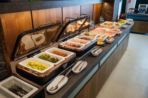 a buffet line with many different types of food at Salt Lake Hotel in Sovata