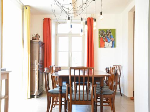 a dining room with a wooden table and chairs at Holiday home in Gedinne with forest in Gedinne