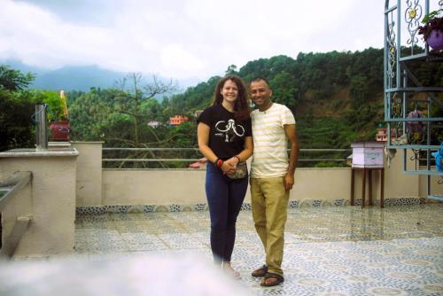 a man and a woman standing on top of a mountain at Udaya Home Stay in Panauti
