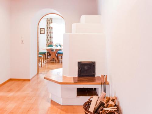 a living room with a fireplace and a table at Apartment in Brixlegg near Ski Juwel Slopes in Rattenberg