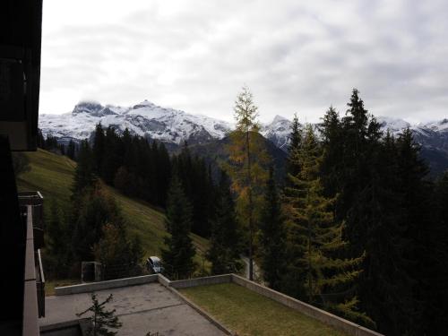 a view of a mountain with snow capped mountains at Chalet in Lenk near Simmen Falls in Lenk