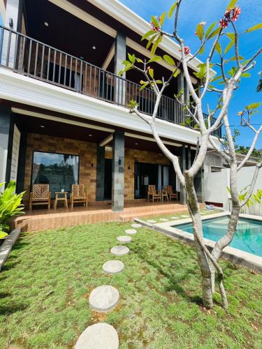 an image of a house with a swimming pool at The Res Village Lombok in Kuta Lombok
