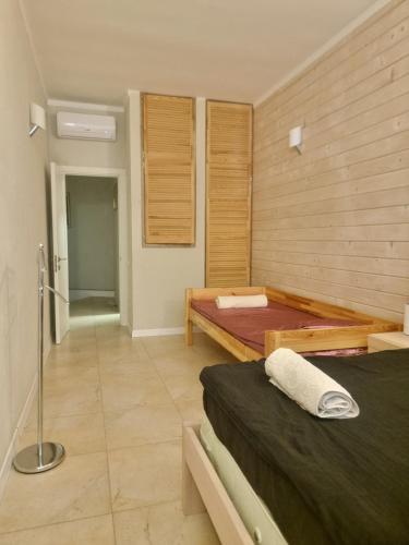 a bedroom with a bed and a tub in it at Gold Bugaz in Odesa