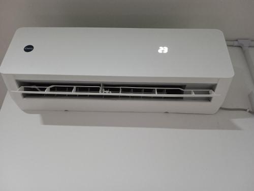 a white computer printer sitting on top of a wall at Guest House 2 in Kuala Terengganu