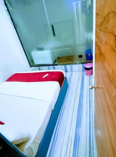 a close up of a bed in a bowling alley at royal guest house and dormitory in asalpha in Mumbai