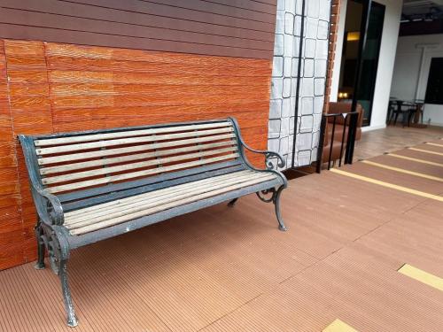 a bench sitting in front of a building at V20 Boutique Jacuzzi Hotel in Bangkok