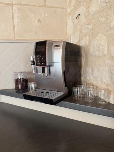 a coffee maker on a counter in a kitchen at La Grange de la Boutelaye in Lésigny