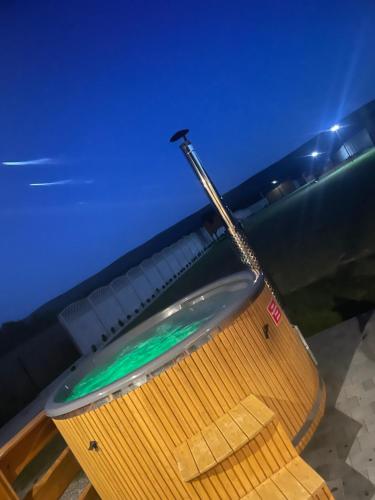 a wooden boat sitting on the beach at night at Bajkowa Chatka in Bodzentyn