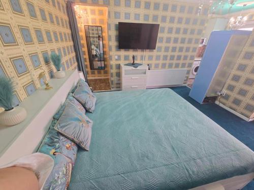 Postel nebo postele na pokoji v ubytování EWA Apartman HAJDÚSZOBOSZLÓ