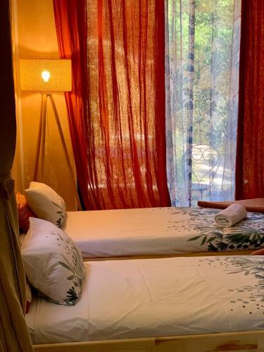 Postel nebo postele na pokoji v ubytování Le Pavillon Vert - B&B