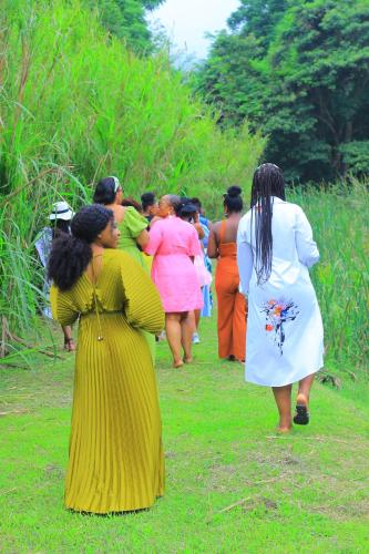 a group of women walking down a field at Nampaton Farm in Drummond