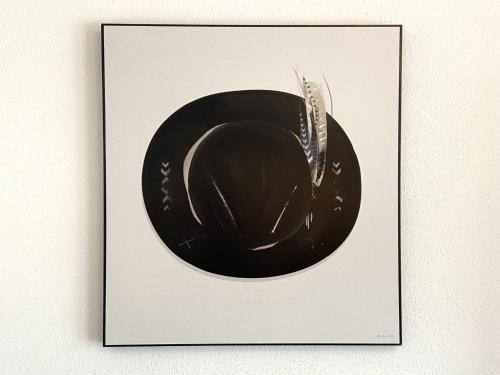 a framed picture of a black bowl on a wall at Beautiful apartment with terrace in Feuring