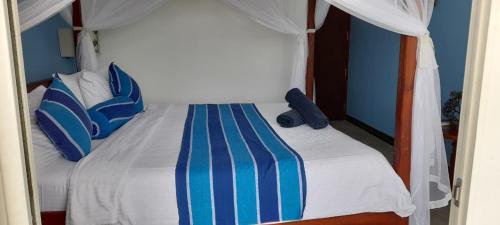 Postel nebo postele na pokoji v ubytování Ocean Moon Mirissa