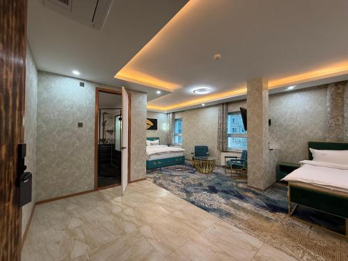 a hotel room with a bed and a bathroom at Unity Hotel - Ulaanbaatar Railway Station in Ulaanbaatar