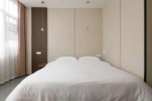 Cama o camas de una habitación en Xiangwang Hotel Shanghai Airport 24H Free Shuttle
