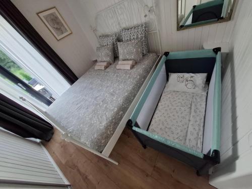 an overhead view of a bed in a tiny house at Sun coast house in Saulkrasti