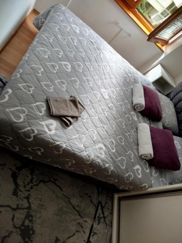 a large comforter on a bed in a room at Uživanje u Sarajevu in Sarajevo