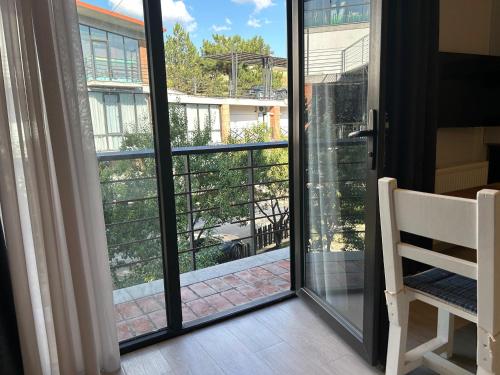 a sliding glass door with a view of a balcony at Chiko Group in Aspindza