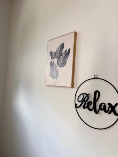 a sign that says relax hanging on a wall at Fichtelcube de in Schönwald