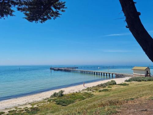 a view of a beach with a pier at New Family Beach Home Near Geelong, St Leonards in Saint Leonards