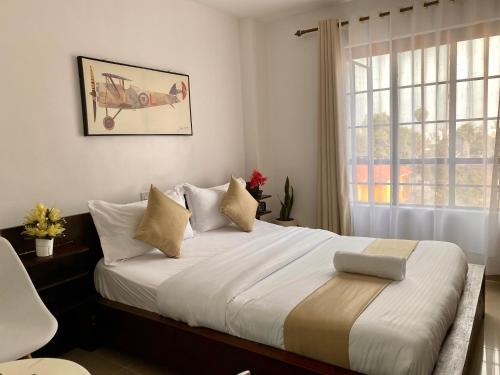 Postel nebo postele na pokoji v ubytování Studio Apartment in Nairobi West