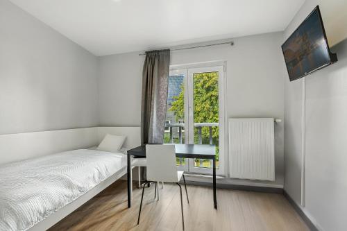 Ένα ή περισσότερα κρεβάτια σε δωμάτιο στο Hotel Engelsburg - Apartments - Ferienwohnungen
