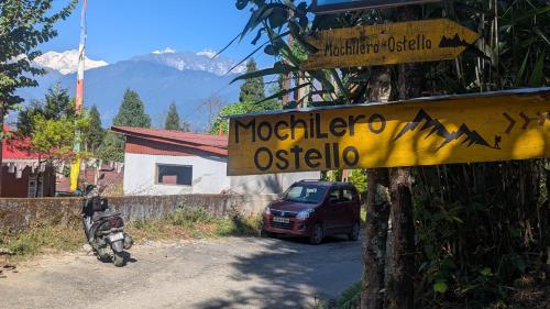 a sign that reads morocco osilia next to a car at Mochilero Ostello in Pelling