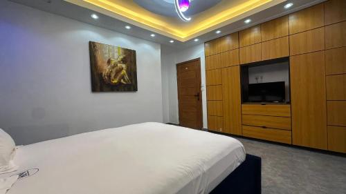 Postel nebo postele na pokoji v ubytování Tchinda Meli Residence