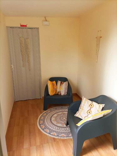 a living room with two chairs and a couch at Avia in Lucera