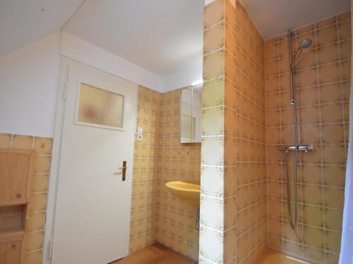 a bathroom with a sink and a shower at Hellenthal Family Retreat in Hellenthal