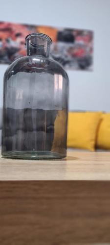 a glass jar sitting on top of a wooden table at NS Bolaños in Bolaños de Calatrava