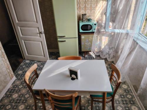 a white table and chairs in a room at Best place to stay in Lagodekhi in Lagodekhi