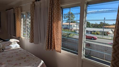 Ένα ή περισσότερα κρεβάτια σε δωμάτιο στο Peace Home