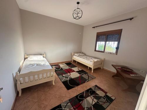 Ένα ή περισσότερα κρεβάτια σε δωμάτιο στο Xhiu guest house