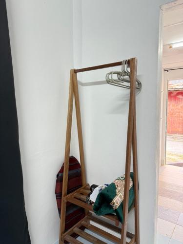 a wooden shelf in a corner of a room at Padang Besar Roomstay Firdaus in Padang Besar