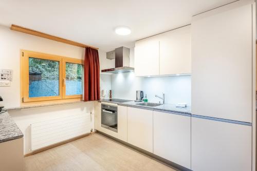 Una cocina o cocineta en Waldhaus Laax