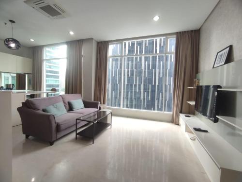 Télévision ou salle de divertissement dans l'établissement Soho Suites KL City Centre
