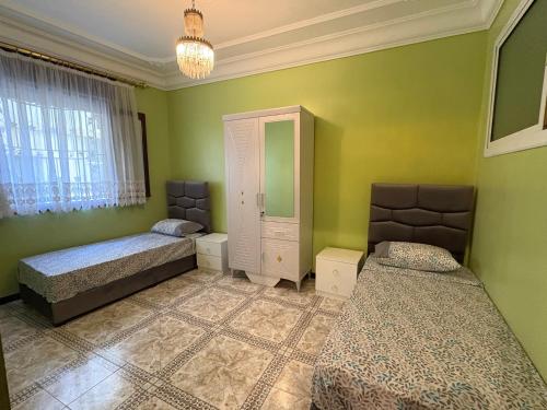Ένα ή περισσότερα κρεβάτια σε δωμάτιο στο Appartement à louer à Tanger