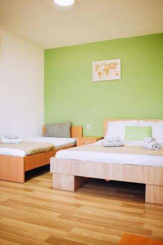 AGH Elite Apartments & Studiosにあるベッド