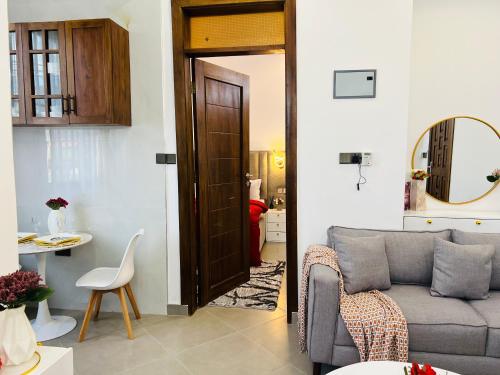 a living room with a couch and a table at DnJ cozy homes in Dar es Salaam