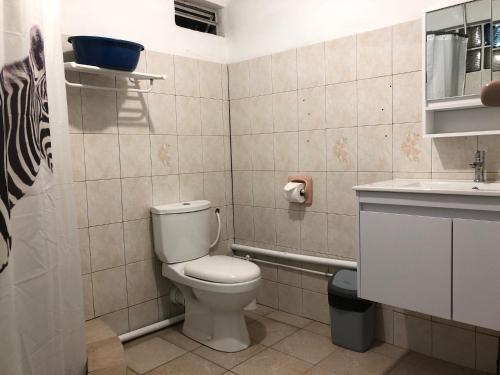 a bathroom with a toilet and a sink at Sabina villa in Pereybere