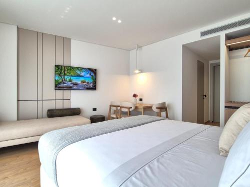 Ένα ή περισσότερα κρεβάτια σε δωμάτιο στο Helia Luxury Suites & Studios