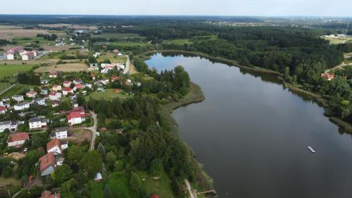 an aerial view of a river and a town at Noclegi Dywity in Dywity