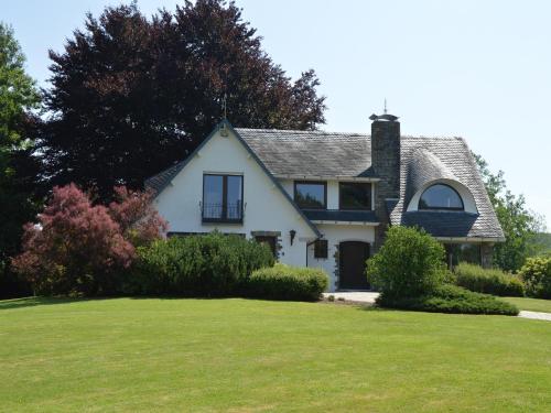 a white house with a green yard at Stay in Stavelot, Liege in Stavelot