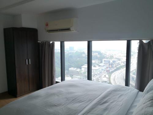 Ένα ή περισσότερα κρεβάτια σε δωμάτιο στο Empire City My Loft